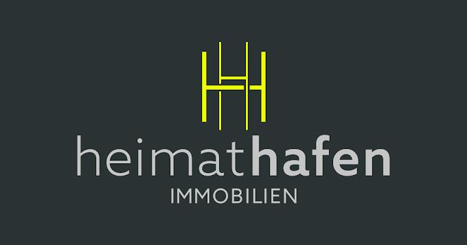 Logo von heimat hafen immobilien in gelb und grau auf dunklem Hintergrund. Buchstaben "H" stilisiert dargestellt.