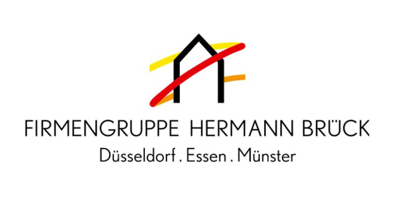 Logo der Firmengruppe Hermann Brück mit den Städten Düsseldorf, Essen und Münster in stilisierter Schrift und grafischen Elementen.