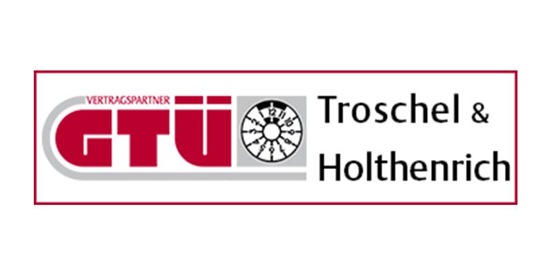 Logo der GTÜ Troschel & Holthenrich mit Schriftzug „Vertragspartner“ und abgebildetem Prüfgerät.