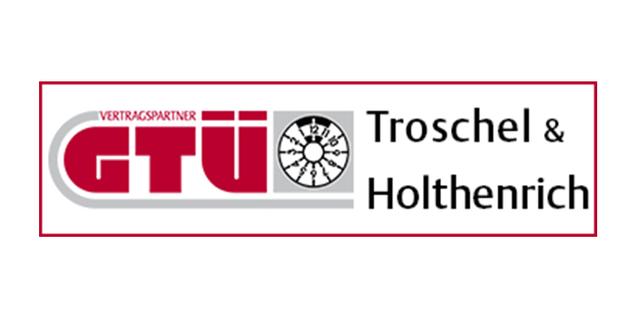 Logo der GTÜ Troschel & Holthenrich mit Schriftzug „Vertragspartner“ und abgebildetem Prüfgerät.